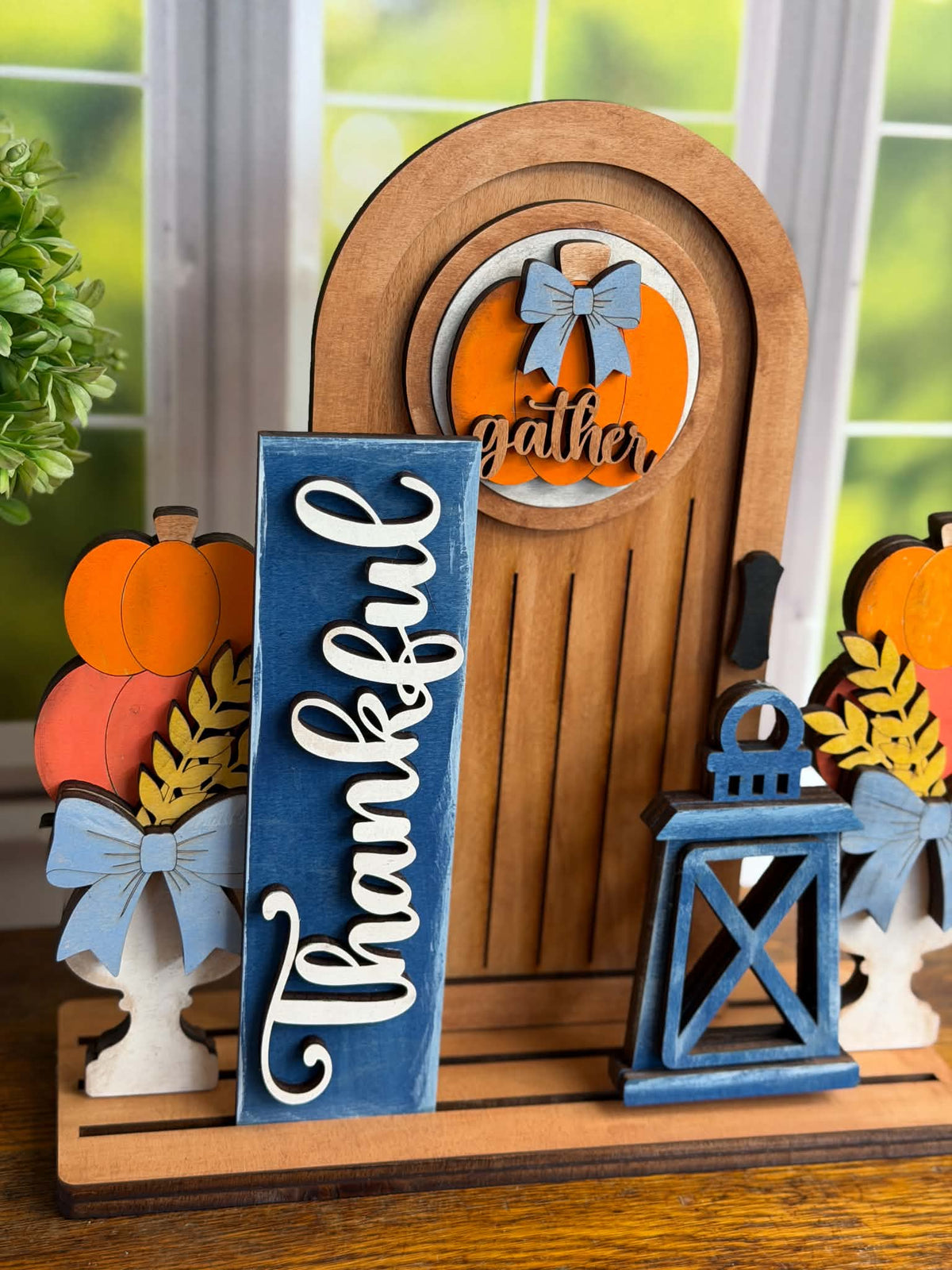 Finished DIY fall tabletop display with interchangeable pumpkin door insert, Thankful sign and lantern