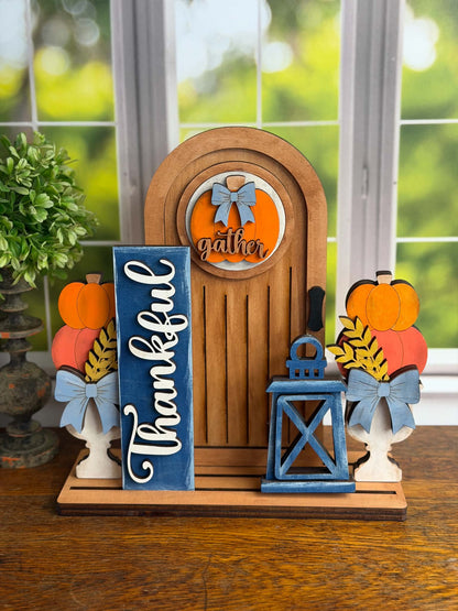 Finished Thankful DIY wood tabletop décor with arched door, pumpkins, lantern and interchangeable fall insert
