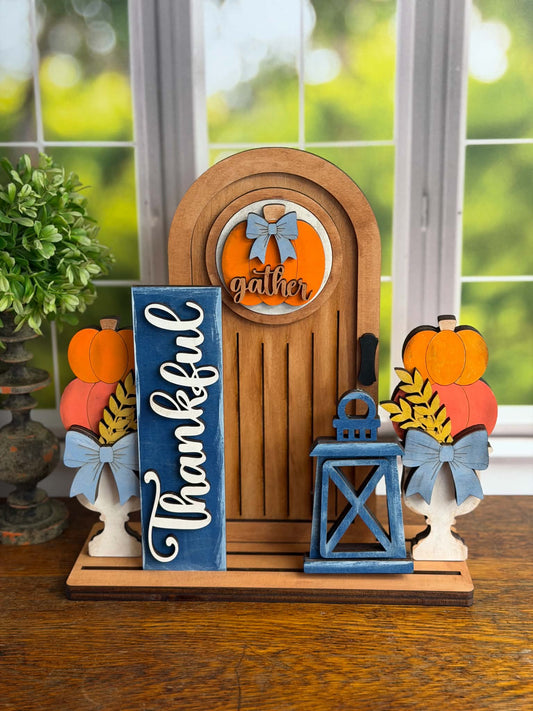 Finished Thankful DIY wood tabletop décor with arched door, pumpkins, lantern and interchangeable fall insert