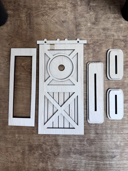 Unfinished laser-cut wood pieces included with the interchangeable post door retrofit kit