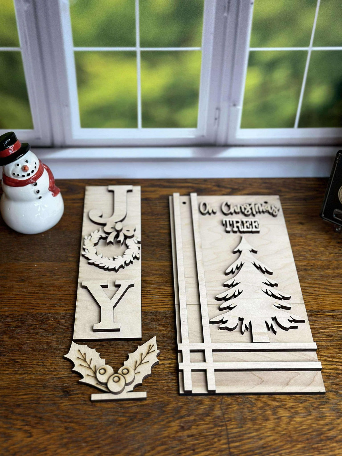 Unfinished JOY Christmas DIY craft kit with wreath lettering insert, Oh Christmas Tree hanging sign and holly berry pop-out.