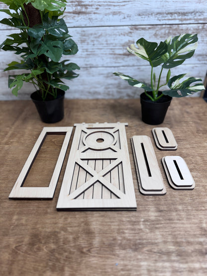 Unfinished laser-cut wood door retrofit kit pieces ready to paint and assemble